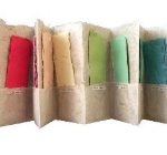 Pulped Screen Shot Accordion book made out of paper, each fold has a pocket, and each pocket has a colored piece of handmade paper inside. Colors of purple, red, yellow, green, and blue.