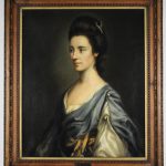 1997.001.0003_Front_1 19th century portrait of woman wearing blue dress. Her dark brown hair is up and she is looking to the left.