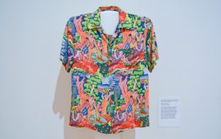 Aloha shirt featuring Hawaiian people in a landscape setting; bright colors