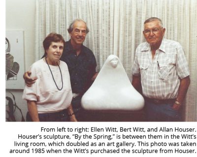 From left to right, Ellen Witt, Bert Witt, Allan Houser. A white marble statue of a Native American woman sits on a table between the couple and the artist, Allan Houser.