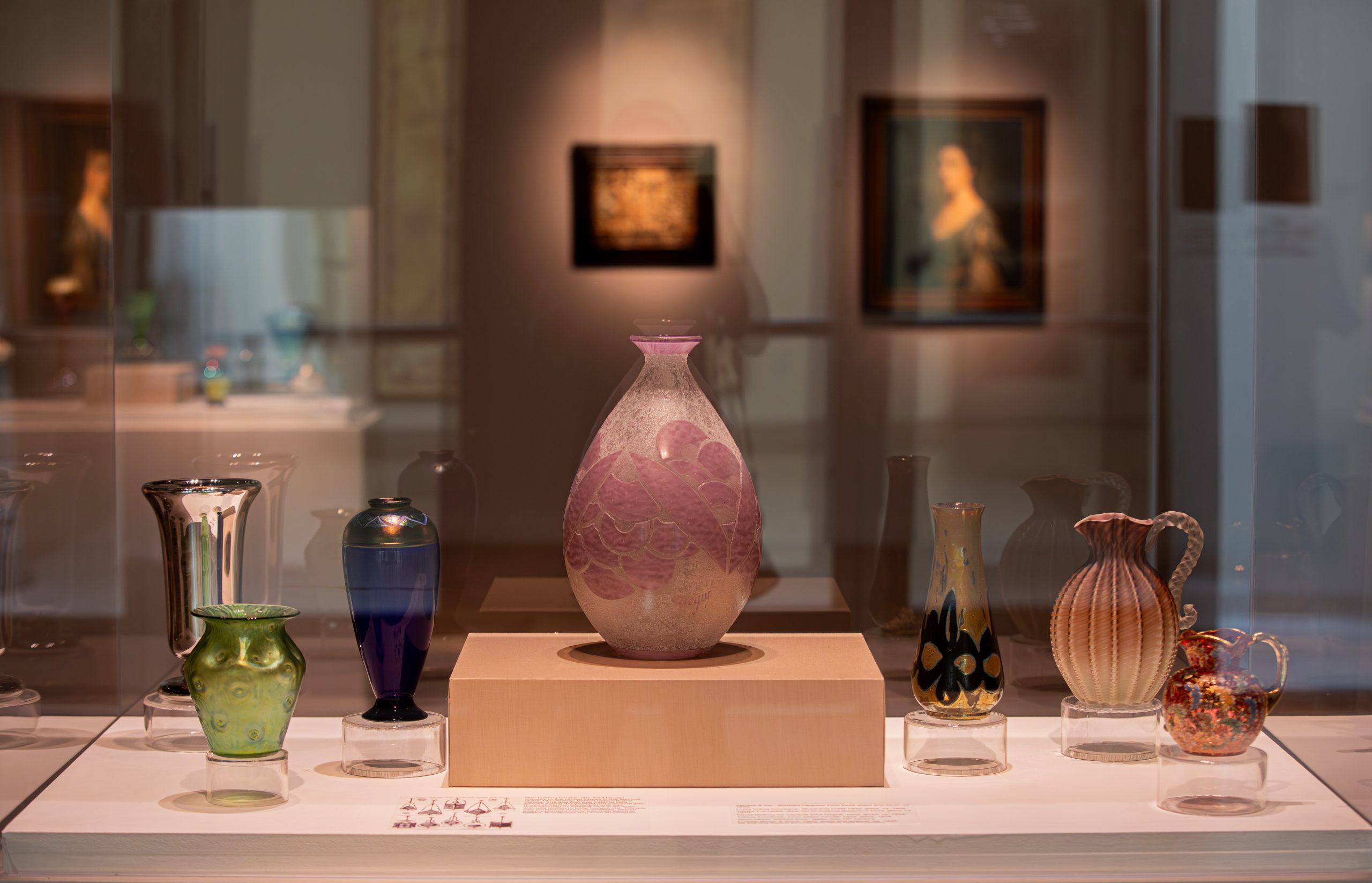 Display case of glass vases