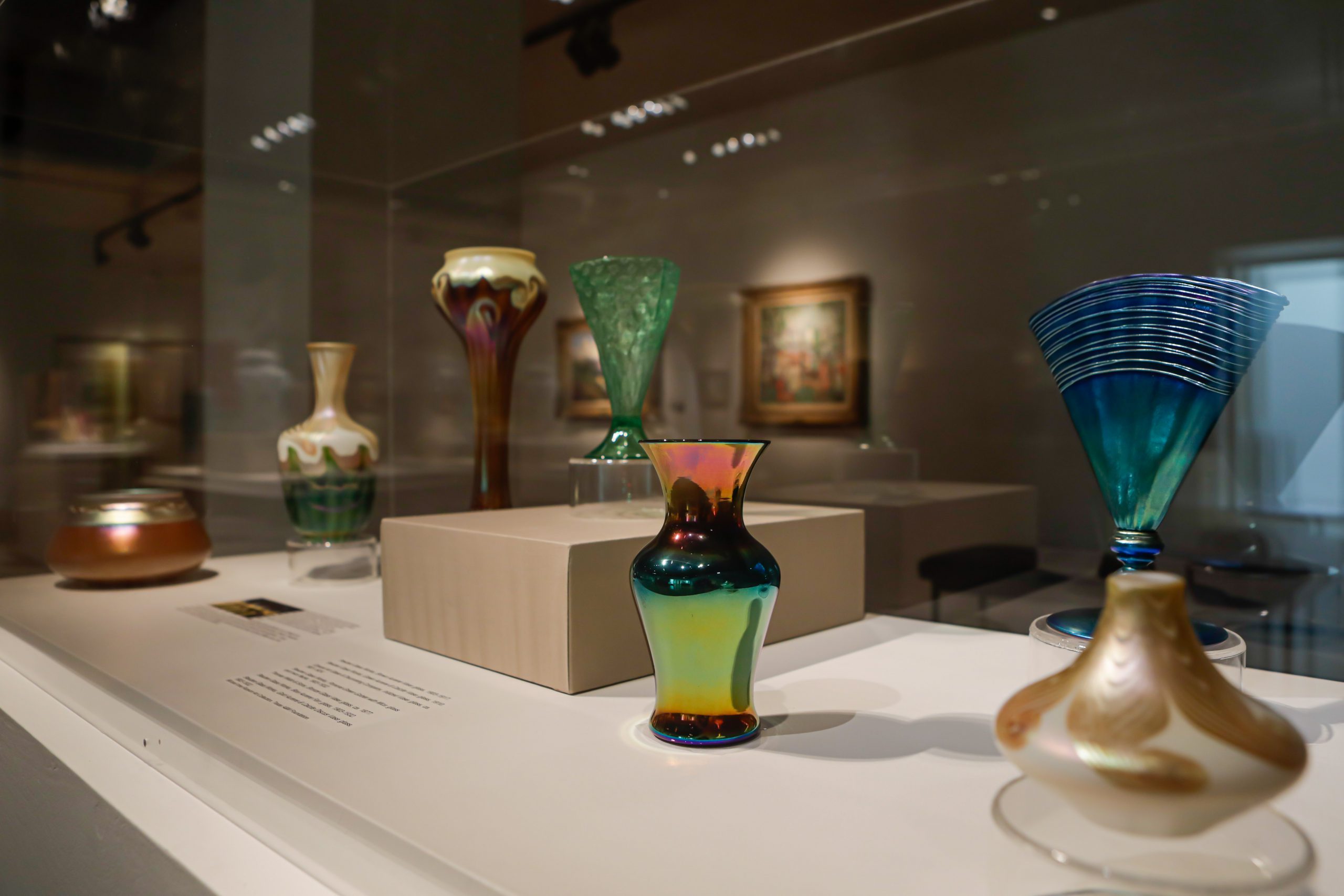 Display cases of small, glass jars and vases