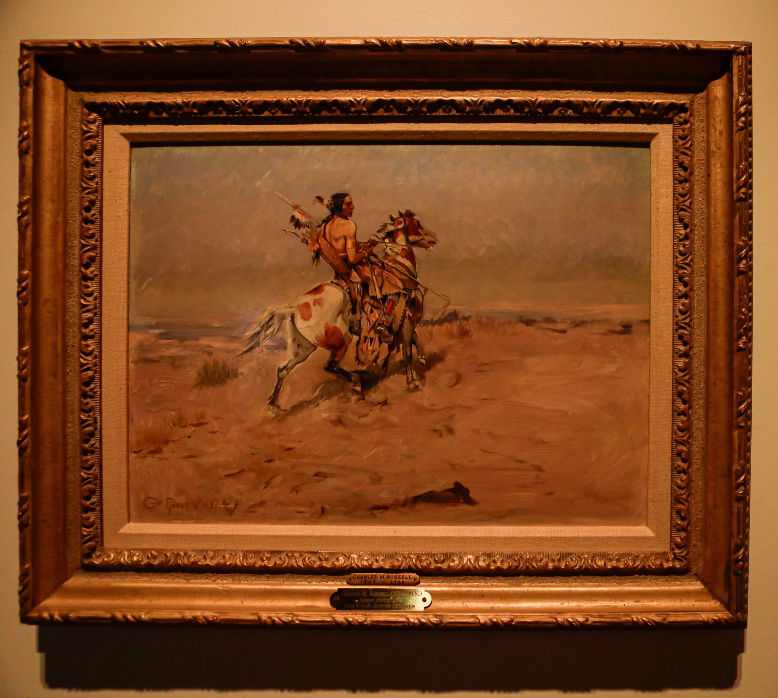 Oil painting of a Native American on horseback. This image shows the painting as it would look under gas lighting.