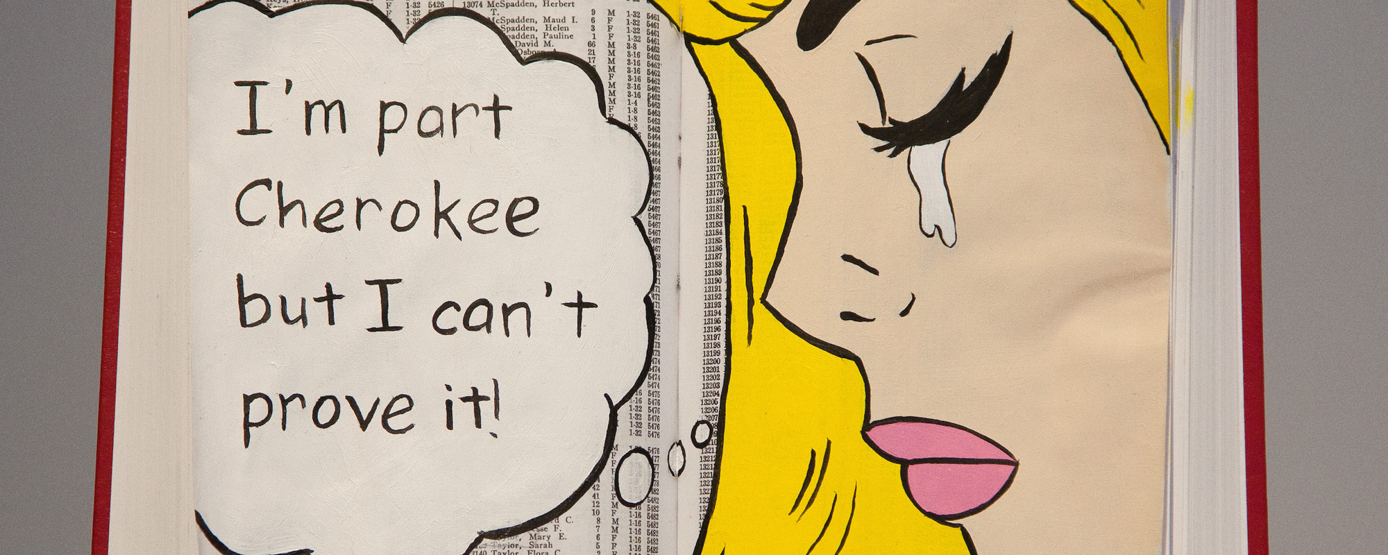 Painting inside of an open book. Woman with blonde hair is crying. Talk bubble reads, "I'm part Cherokee but I can't prove it."
