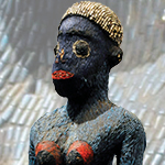 Cameroonian beaded fertility goddess.