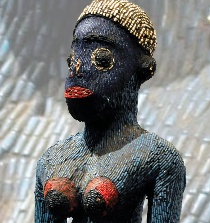 Cameroonian beaded fertility goddess.