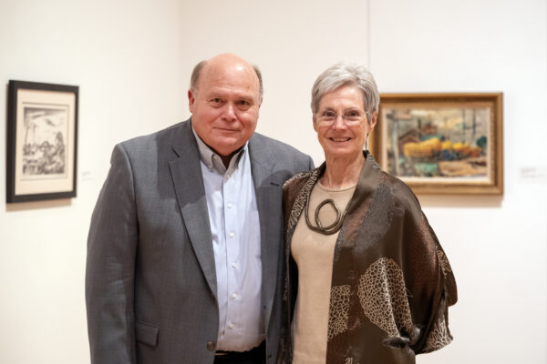 Bill and Linda Reaves stand next to each other in the Stark Galleries. 