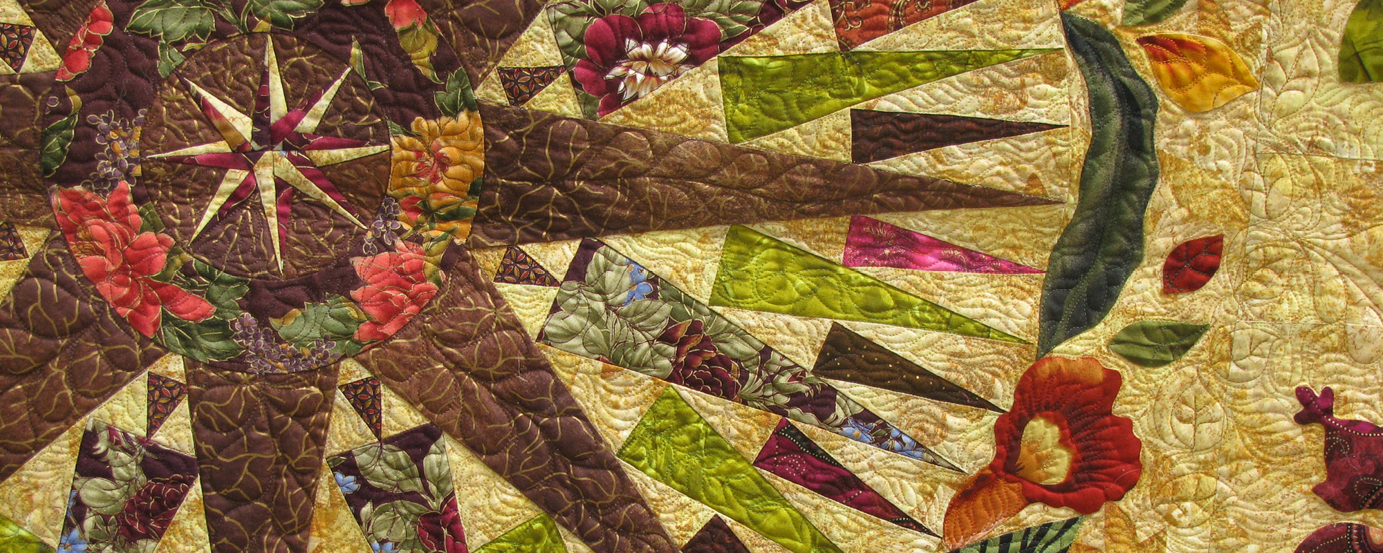 Detail of a quilt with a 64-point compass in the middle
