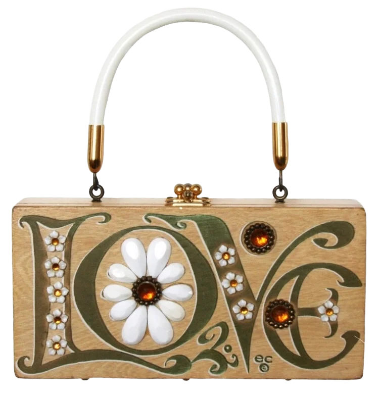 A box purse with the word LOVE painted on it and a white daisy in the letter O. 